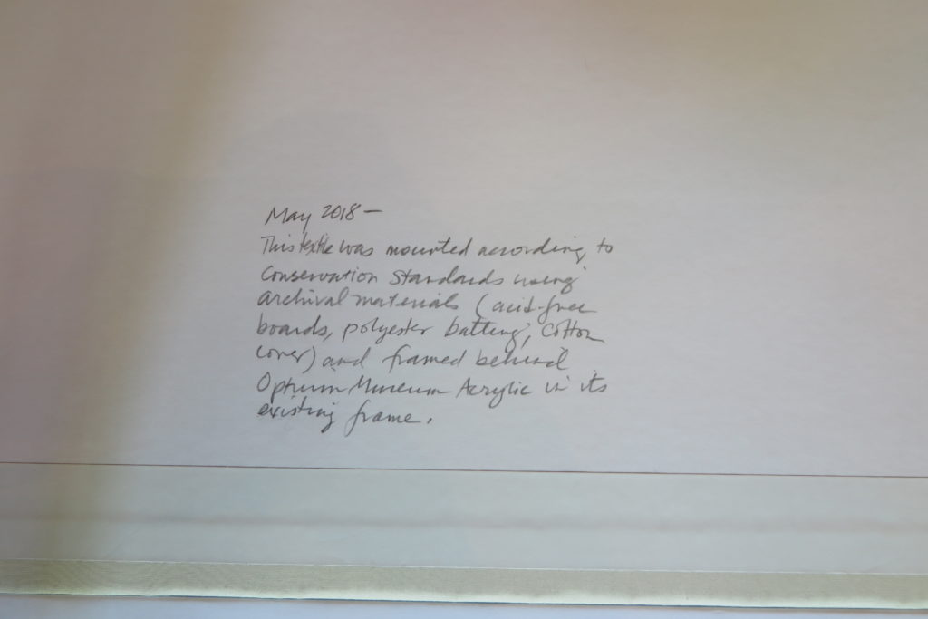 Handwritten note detailing conservation standards and materials used for mounting artwork.