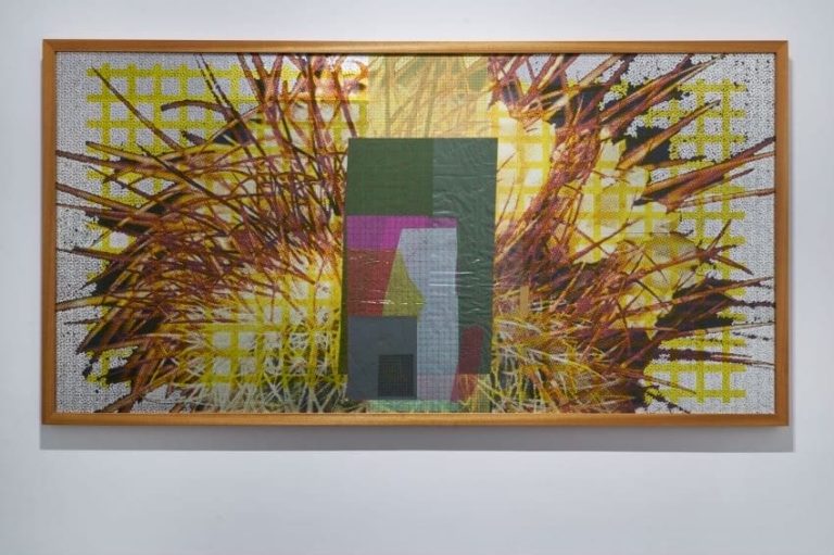 Installation view of "Folding the Distant - 2 (2022)," Zhang Ruyi. Wood board, aluminum alloy, aluminum foil, UV print, silkscreen print, colored acetate paper, card stock, colored cellophane, sandpaper, copper wire, nylon mesh, plastic film, adhesive tape, 128 cm x 246 cm (including frame). UCCA Center
for Contemporary Art. Photo courtesy of the artist.