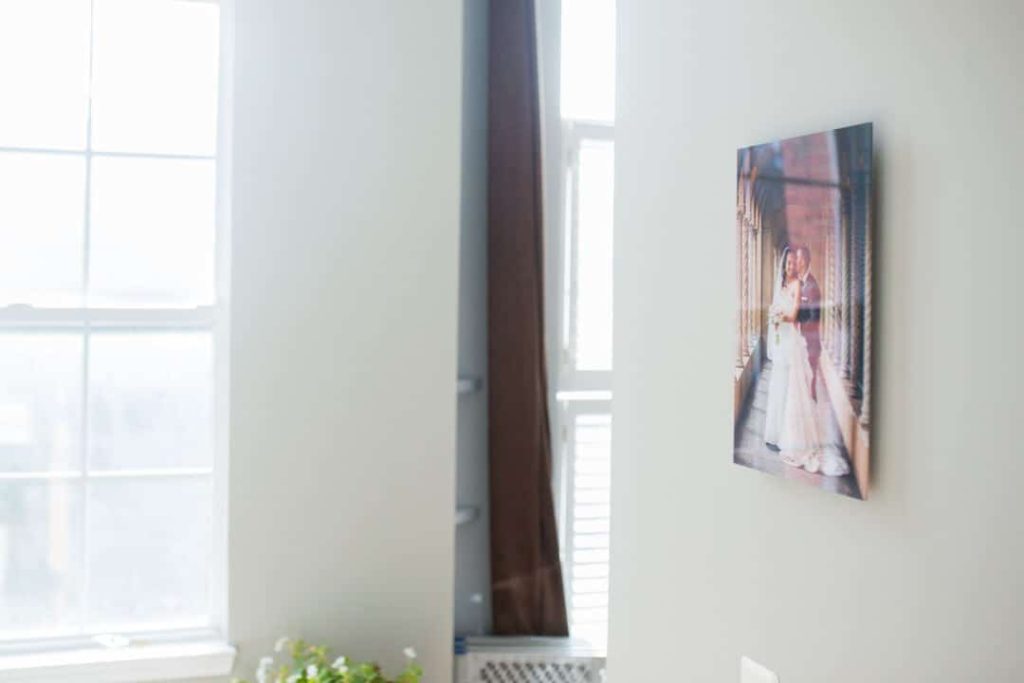 Photo print displayed in a poorly lit area with reflections.