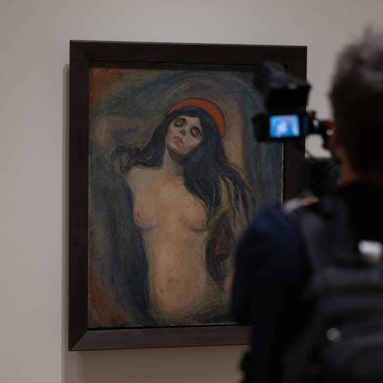 photo of a person taking a photo of Edvard Munch, Madonna in situ