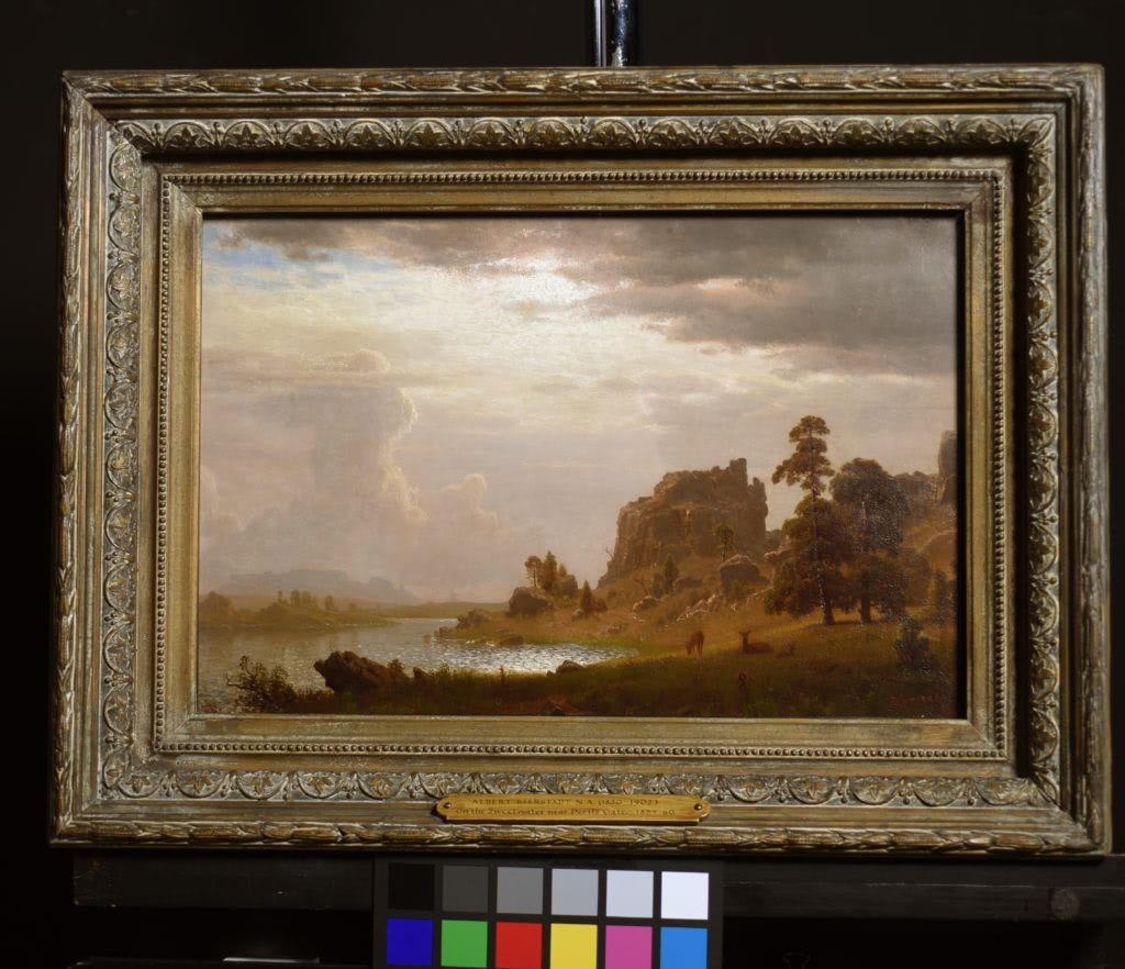 Albert Bierstadt’s On the Sweetwater Near the Devil’s Gate of 1860 after frame restoration and glazing with Optium Museum Acrylic. Photo documentation and work by The Fine Arts Conservancy.