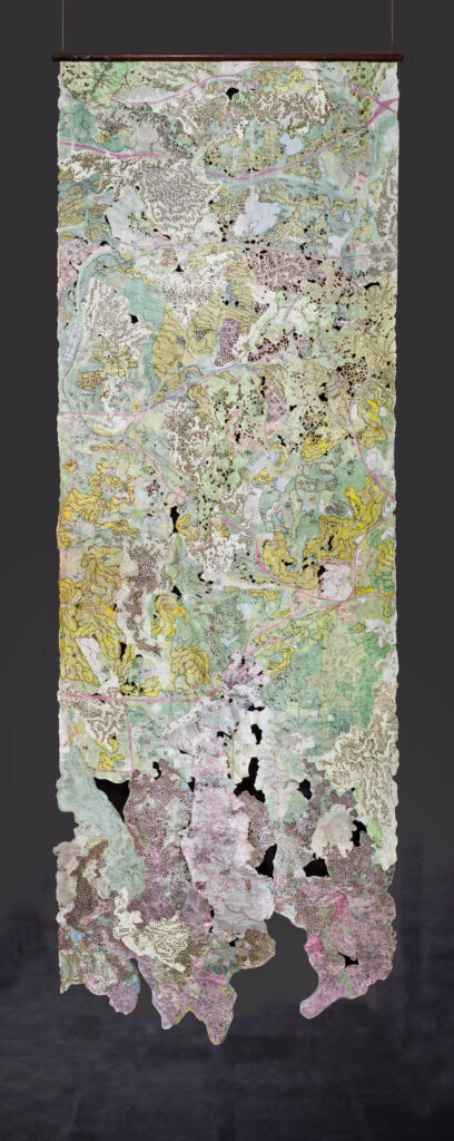 Zelin Seah, “This Land is ( ) Land”, 2022, Collage of burnt and washed topography maps, 205 x 67 cm