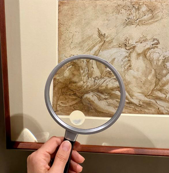 Handheld magnifiers provided in the exhibition space to observe the minute details of the artist’s hand.