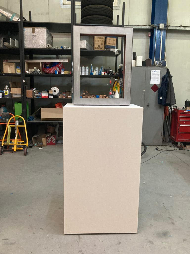 Production image of plinth designed to allow double-sided viewing.